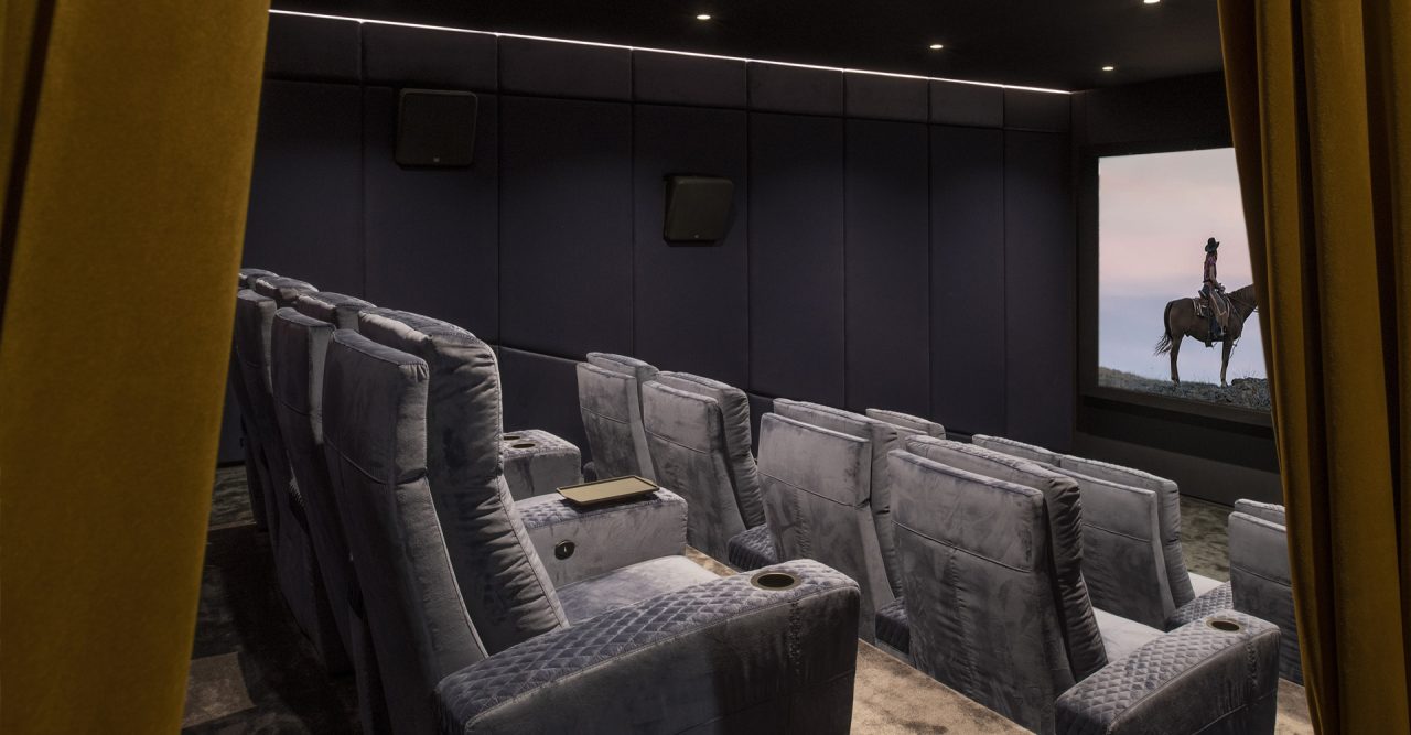 Luxury Home cinema with Ferrier seating. Roland Koller Signature Design curtains entrance cineak