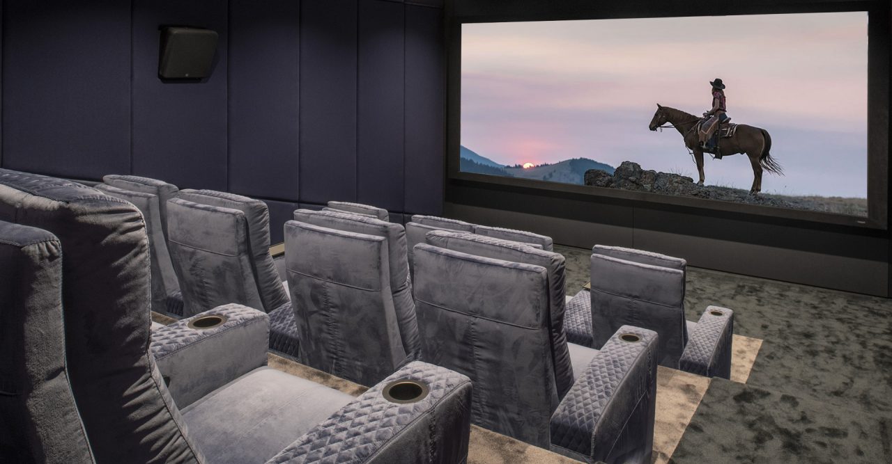 Luxury Home cinema with Ferrier theater seating. Grey plushy Roland Koller Signature Design